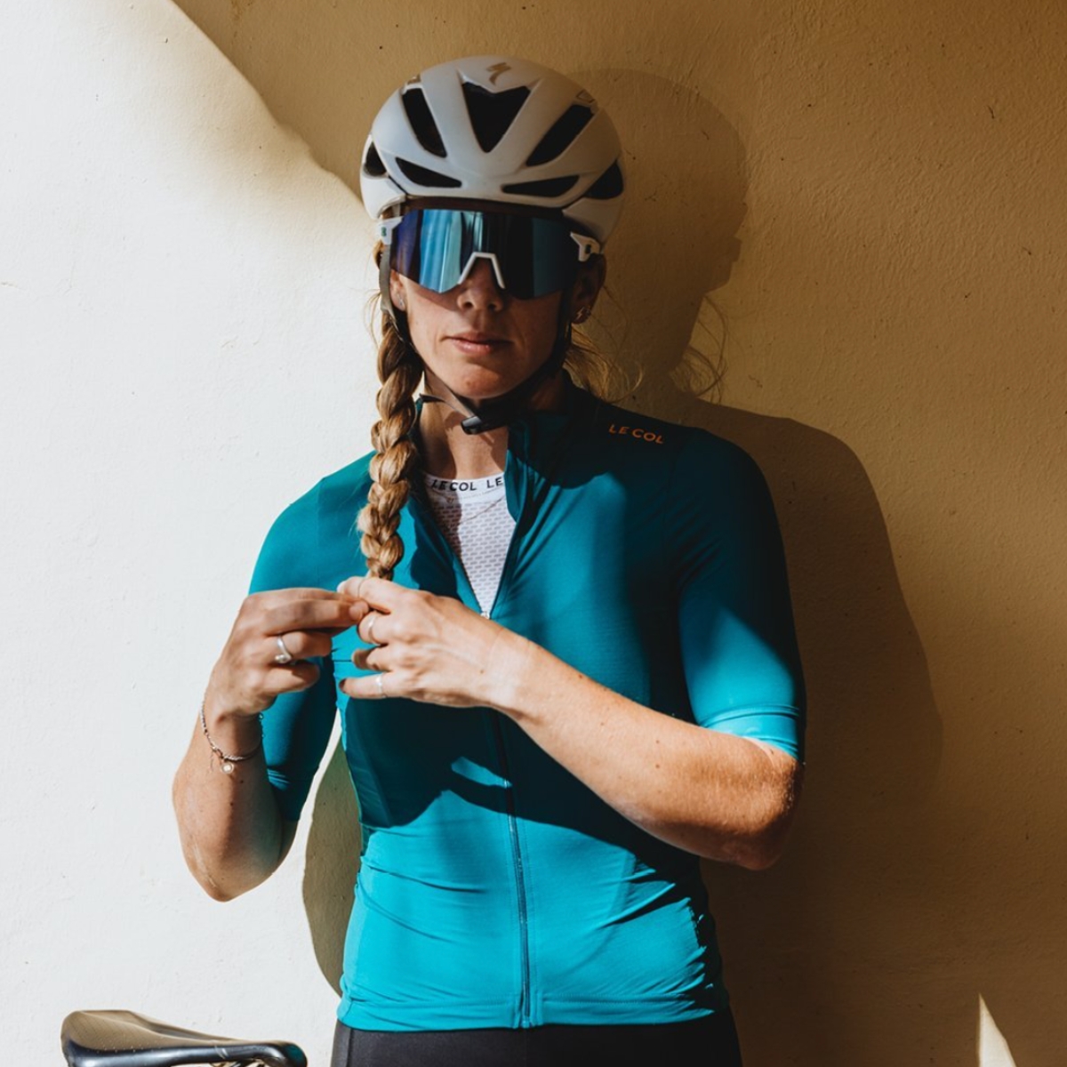 Woman with braid wearing Lecol cycling clothing brand