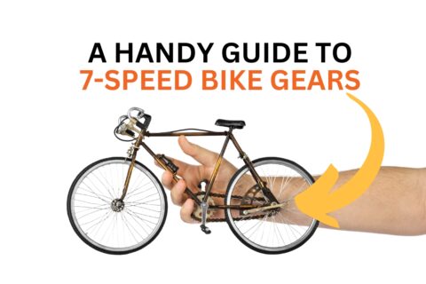 Hand holding a small bicycle with text, "A Handy Guide to 7-speed Bike Gears".