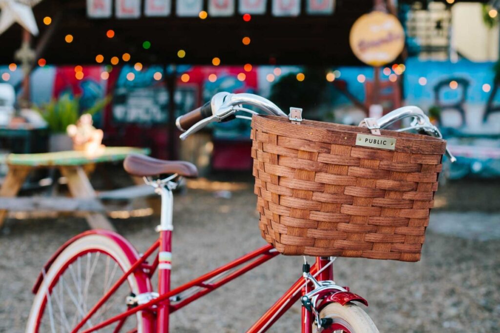 A front bike basket on a red bicycle