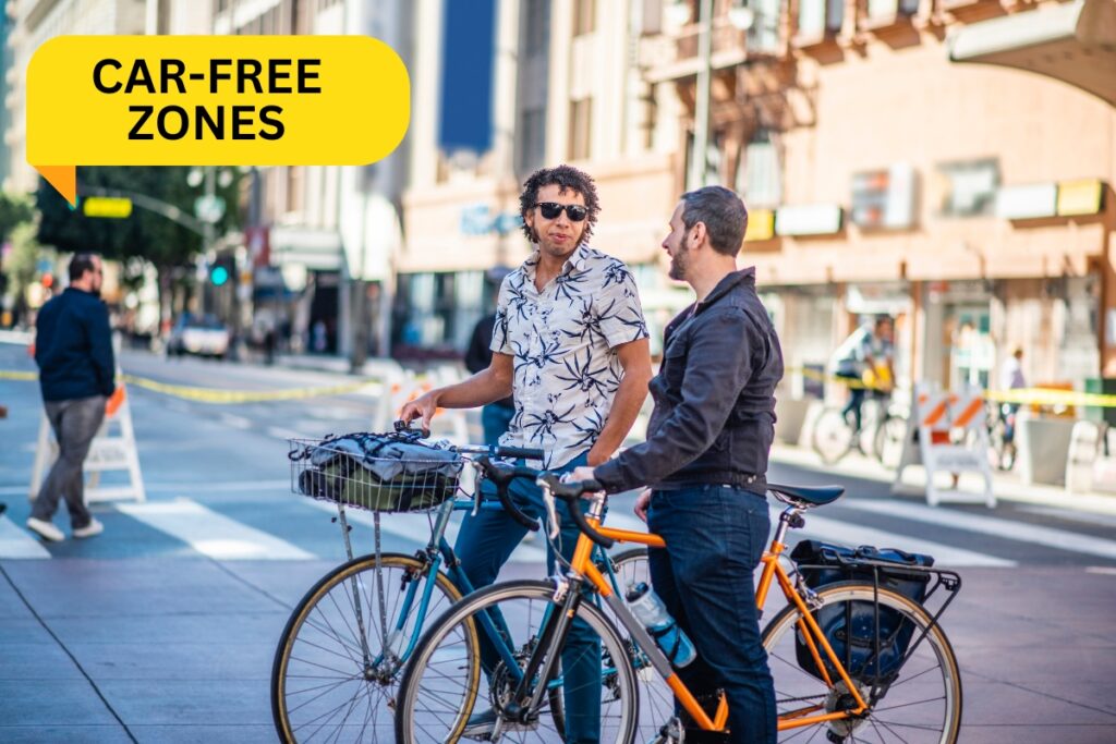 Two men with bicycles in a car-free zone