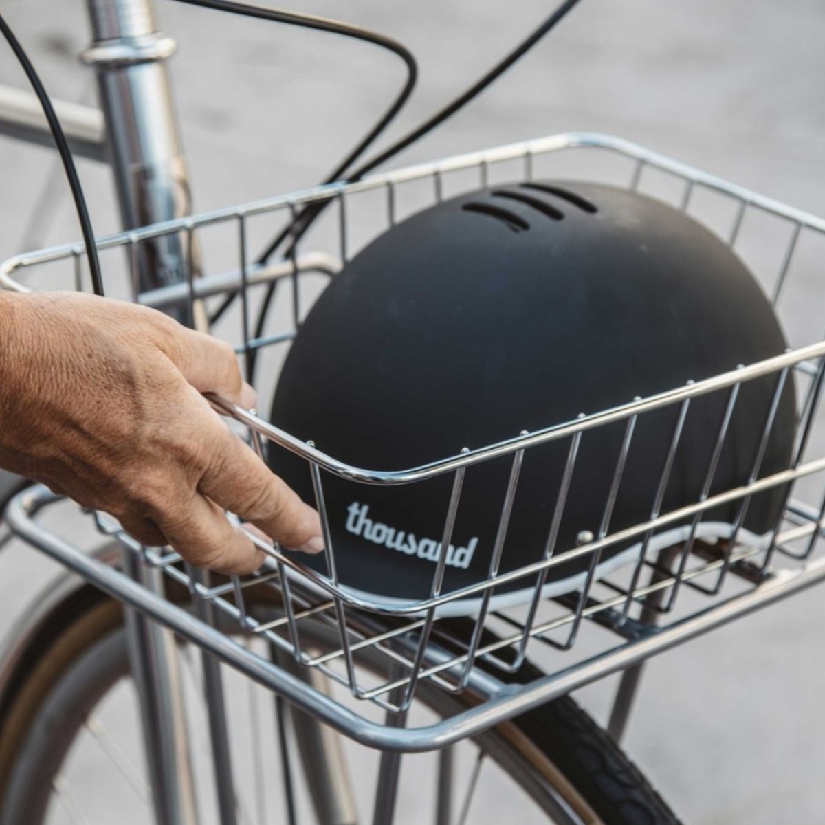 Public bikes rear metal bike basket with a helmet inside