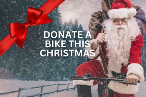 Santa Claus riding a bicycle