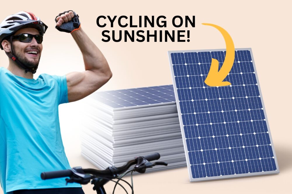 CYCLIST IN FRONT OF SOLAR PANELS