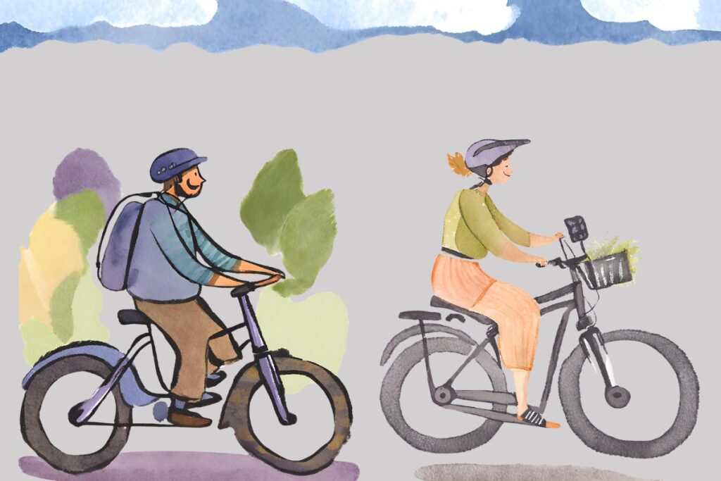 A man and a woman riding e-bikes