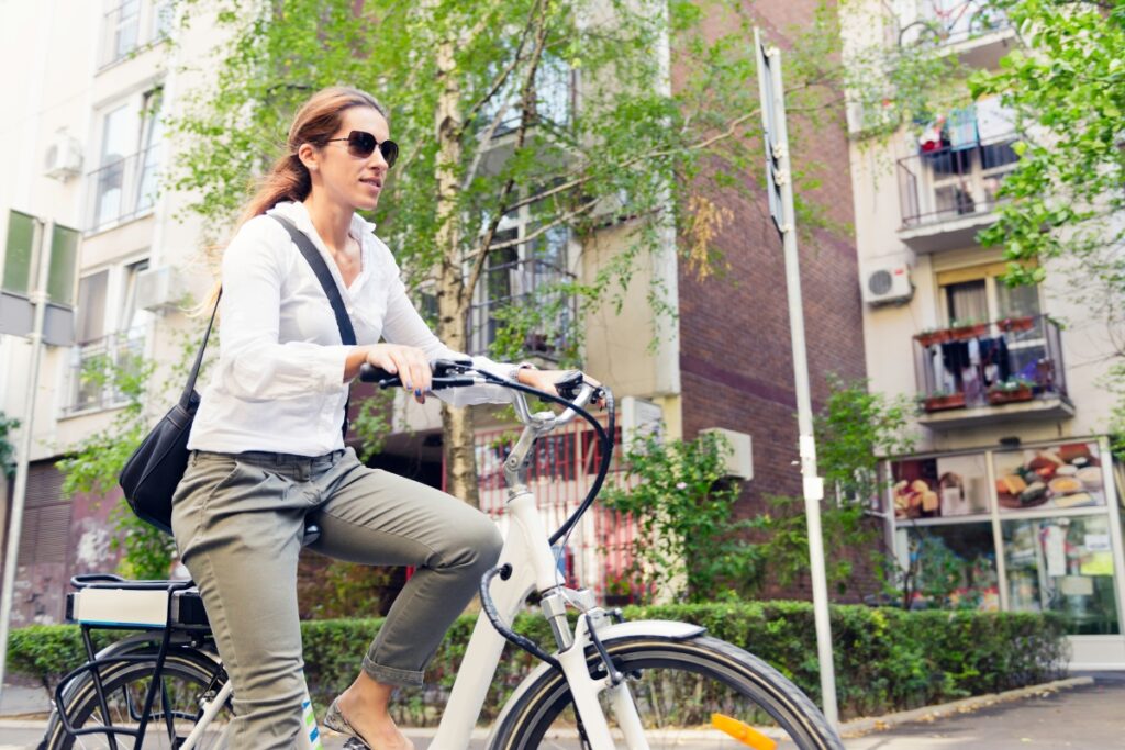 woman riding e-bike in the city
