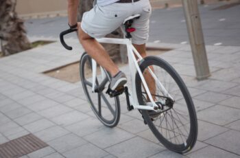 A man wearing shorts while cycling on a bicycle