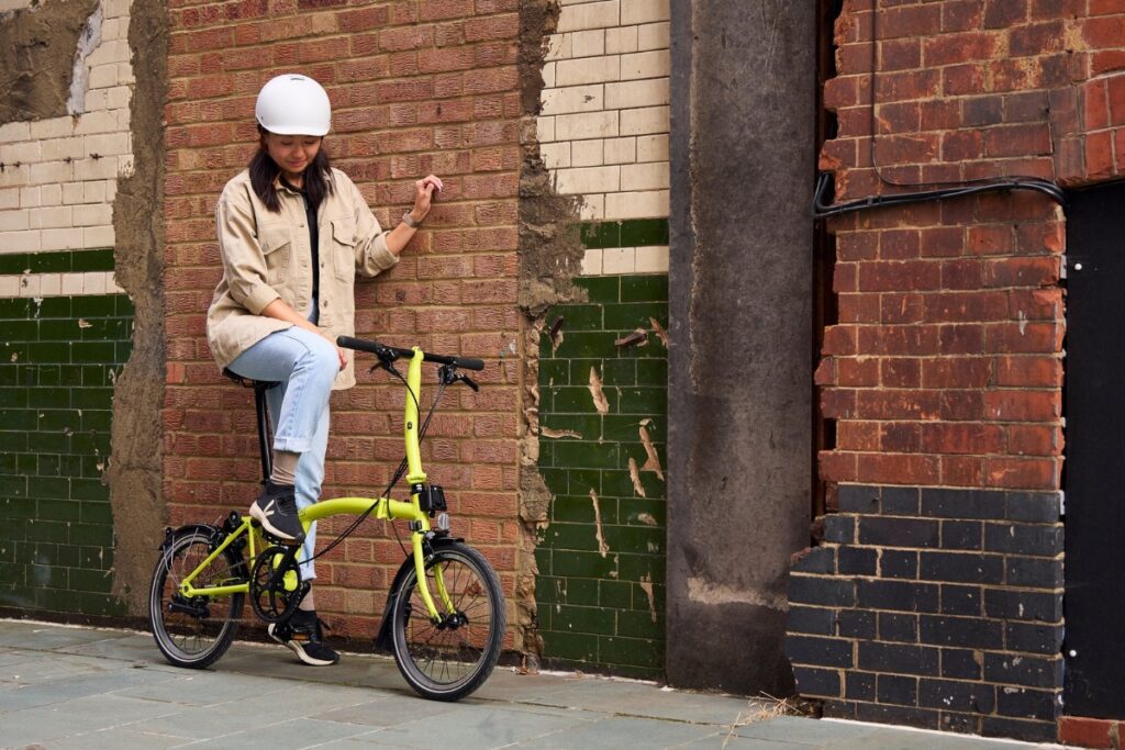 Woman with Brompton Folding Bicycle